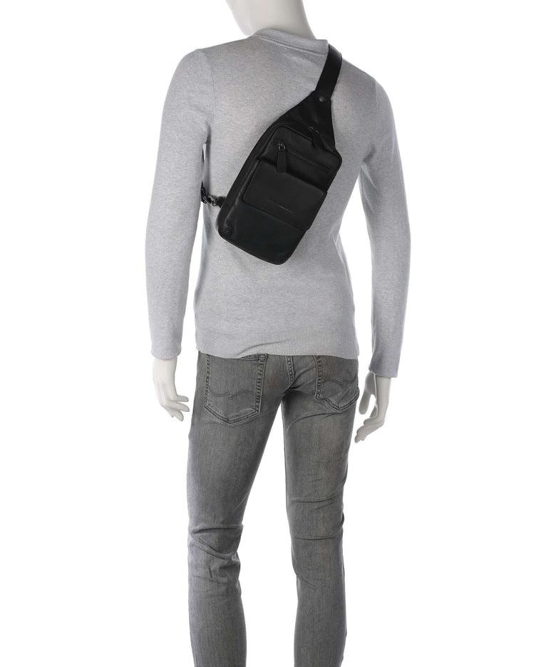 The Chesterfield Brand Wax Pull Up Cow Turelle Sling bag black